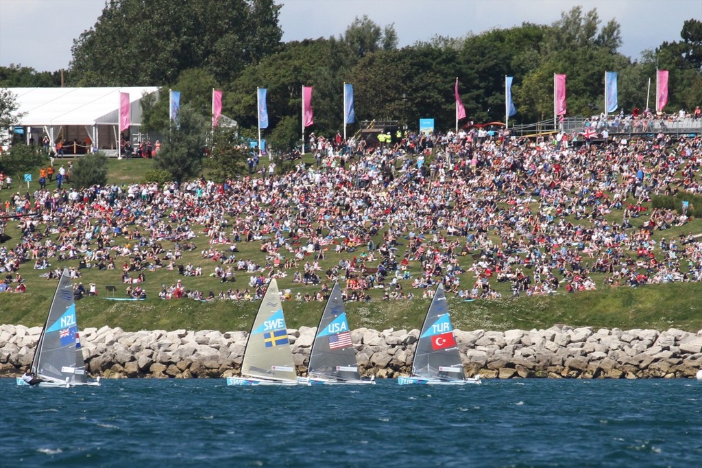 July 29, 2012  Finn class, Race 1, In front of the fans on the Nothe &copy; Richard Gladwell www.photosport.co.nz